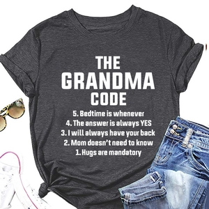 Flat lay of dark gray cotton T-shirt featuring white The Grandma Code graphic and text