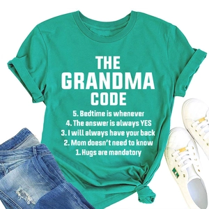 Green cotton t-shirt with white Grandma Code slogan print and casual flat lay styling