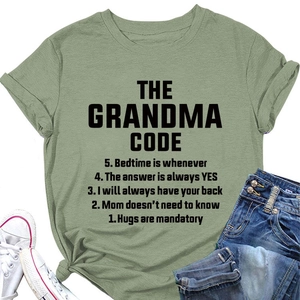 Flat lay of green cotton T-shirt with Grandma Code print, denim jeans and white sneakers