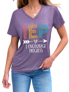 Close-up of women's purple V-neck T-shirt with IEP lettering and heart patterns