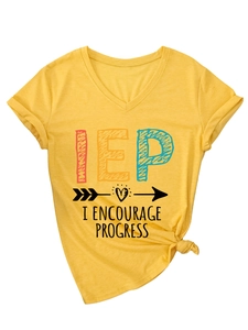Detail of yellow V-neck T-shirt with I ENCOURAGE PROGRESS print and stylish front hem knot