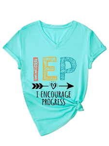 Detail of turquoise V-neck T-shirt featuring IEP I Encourage Progress text and knot hem