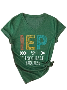 Close-up of heather green V-neck t-shirt with IEP printed text and knotted hem detail
