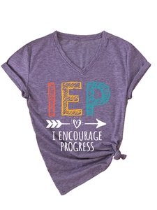 Detail of purple V-neck t-shirt featuring I Encourage Progress print and stylish hem knot