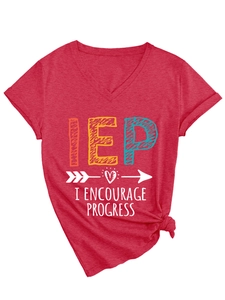 Detail of red V-neck T-shirt with IEP print and stylish side knot on white background