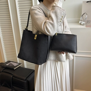 Chic black matte bucket bag and pebbled pouch set for women with golden twist lock