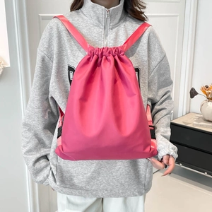 Modern light pink drawstring backpack for women, large capacity waterproof sports rucksack