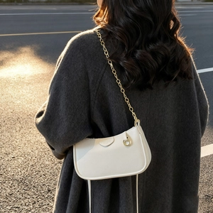 Chic beige lychee textured underarm bag with gold chain and thin shoulder strap