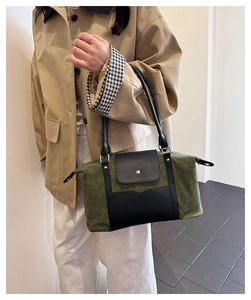Detail of vintage canvas travel bag with leather accents and comfortable shoulder strap
