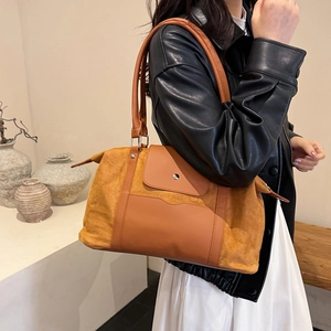 Brown large capacity travel handbag featuring a stylish mixed texture patchwork design