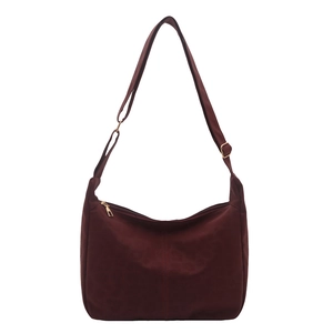 Minimalist burgundy large tote bag with gold zipper and adjustable wide shoulder strap