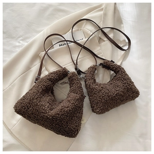 Detailed comparison of brown teddy faux fur tote bags in large and small sizes with leather straps