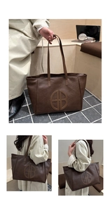 Detailed view of dark coffee vintage tote bag featuring embossed HB logo and fine straps