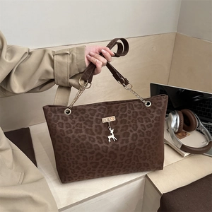 Brown leopard print tote bag with gold chain strap and deer pendant for daily commuting