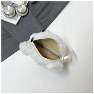 Detail of white plush bear tote showing the interior fabric lining and black zipper top
