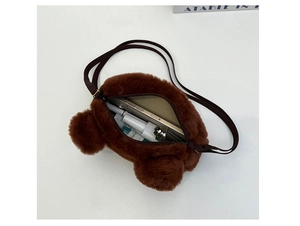 Detail view of plush brown bear bag interior showing zipper and storage capacity