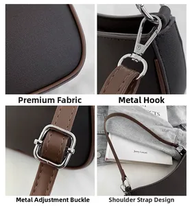 Detail van bruine canvas schoudertas met zilveren hardware en verstelbare riem