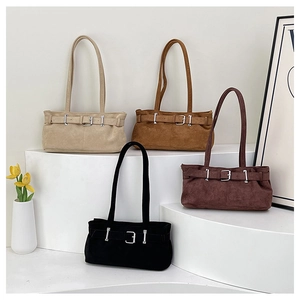 Minimalist vintage shoulder bags displayed in beige, brown, and black suede finishes