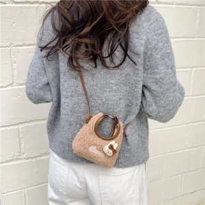Brown faux shearling handbag with cute white bunny detail and leather shoulder strap