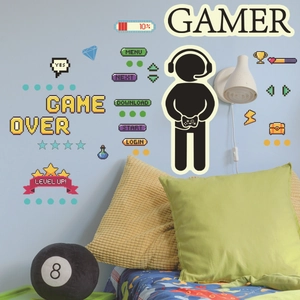 Luminous game controller wall decals with pixel art gamer slogans in a cozy bedroom
