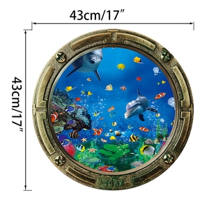 Detail view of 3D submarine porthole wall decal with dolphins and tropical fish, 43cm diameter