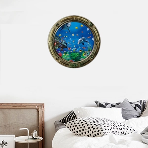 3D submarine porthole wall decal showing dolphins and tropical fish in a bedroom