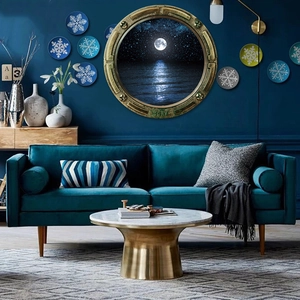 Detail of vintage bronze submarine porthole wall decor featuring a moonlit seascape