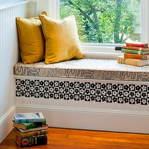 Detail of black and white floral checkerboard wall sticker applied on furniture