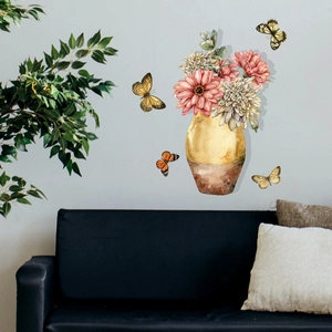 Detail of watercolor flower vase wall decals with pink daisies and butterflies on grey wall