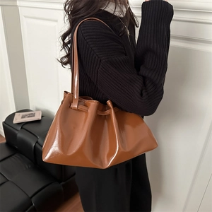 Caramel brown patent leather cloud bag with drawstring for women over the shoulder