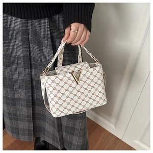 Fashionable crossbody bag with brown chain print and a golden V-shaped metal buckle
