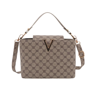 Classic bucket bag with vintage monogram print and gold V-shaped buckle ornament
