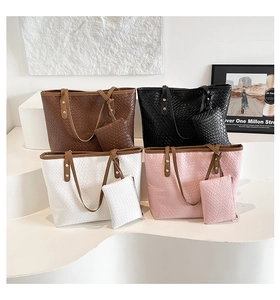 Detailed collection of four woven tote bags with matching zipper pouches in neutral tones