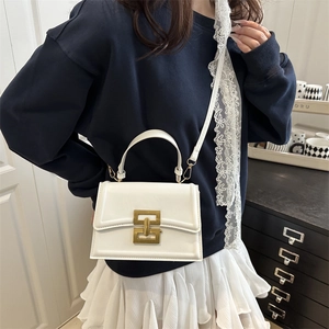 Minimalist white leather square handbag for women with elegant geometric gold metal clasp