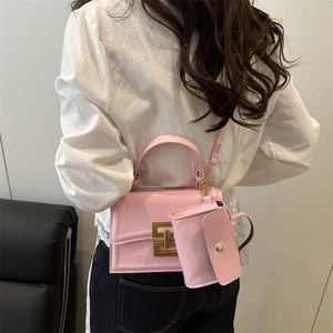 Pink rectangular square shoulder bag with small pendant pouch and gold buckle detail