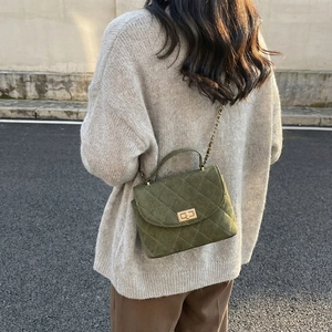 Olive green quilted suede small crossbody bag with gold chain and metal turn-lock