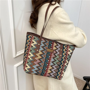 Chic multi-color woven tote bag with zig-zag pattern and brown leather straps for daily use