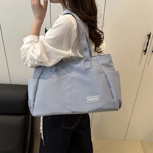 Large capacity fog blue nylon tote bag with Fashion label for winter 2025 casual style