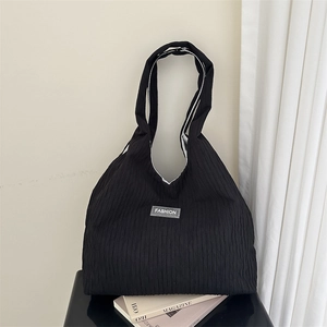 Large black corduroy tote bag with FASHION label and long shoulder strap for women