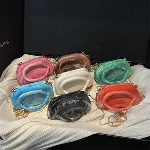 Chic marbled acrylic mini round handbags in various colors with elegant gold chain straps
