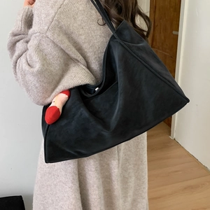 Fashionable black matte suede tote bag for women with a stylish red heel charm accessory