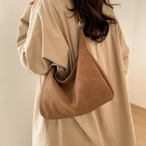 Minimalist brown leather hobo bag for women with soft texture and spacious design