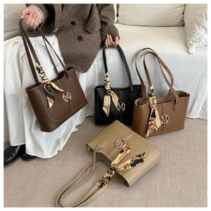 Tote bags with M logo in four colors featuring elegant printed silk scarf handle detail