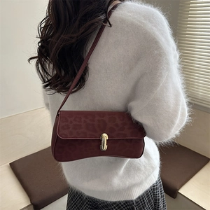 Fashionable burgundy leopard print underarm bag with gold metal buckle for winter outfits
