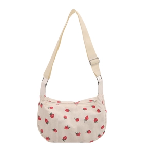Corduroy crossbody bag with red strawberry floral print and adjustable strap