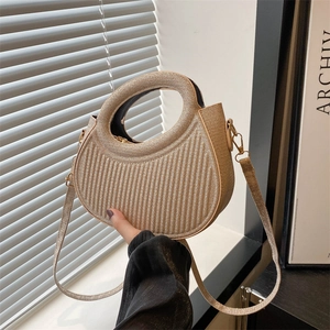 Champagne gold woven handbag with wave texture and integrated round handle for women