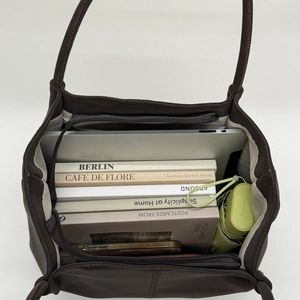 Top view showing the large capacity and organized interior of this dark brown nylon tote bag