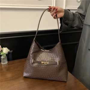 Deep brown crocodile pattern shoulder bag with golden buckle in a stylish half-moon shape