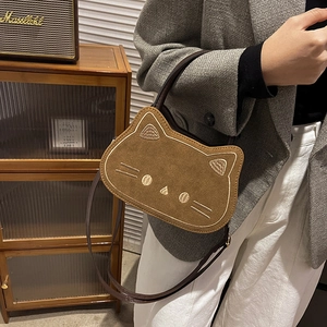 Cute cat-shaped caramel brown crossbody bag with embroidered details and top handle