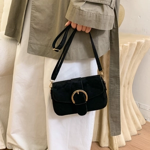 Minimalist black suede crossbody bag with premium gold horseshoe buckle and long strap